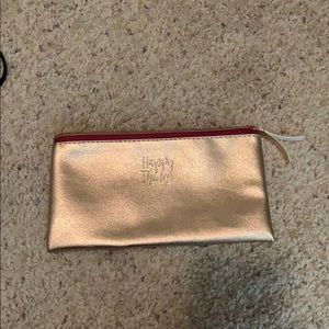 “Happy Things” soft gold metallic clutch.